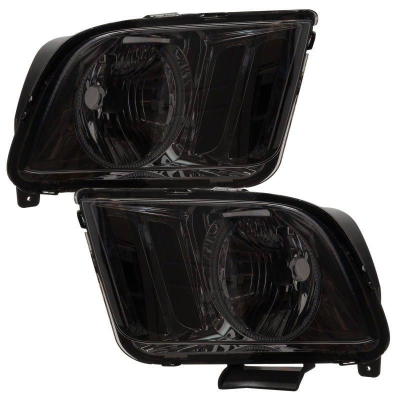 Oracle 05-09 Ford Mustang SMD headlights with white halo rings, showcasing chrome and black housing options.