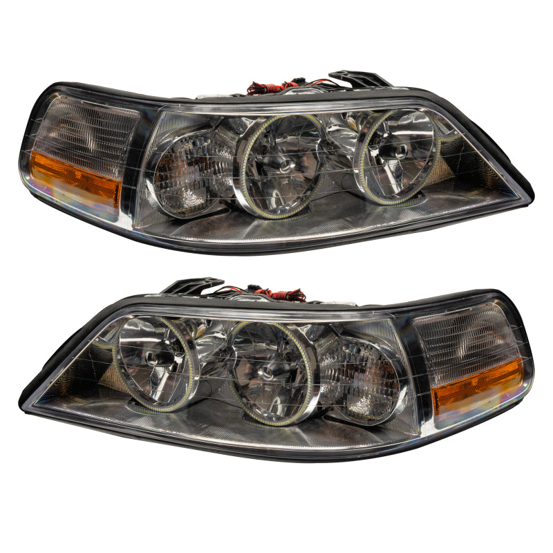 Oracle 05-11 Lincoln TownCar SMD headlights with ColorSHIFT halo rings in Chrome housing, showcasing modern automotive lighting design.