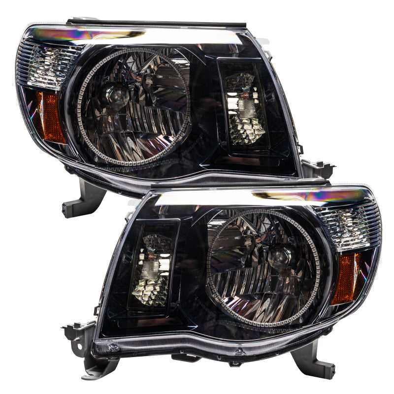 Oracle 05-11 Toyota Tacoma SMD headlights in black with ColorSHIFT technology, showcasing vibrant LED lighting.