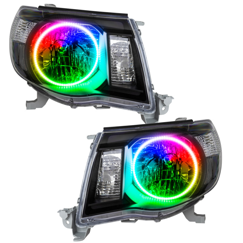 Oracle 05-11 Toyota Tacoma SMD headlights in black with ColorSHIFT technology, showcasing halo rings and sleek design.