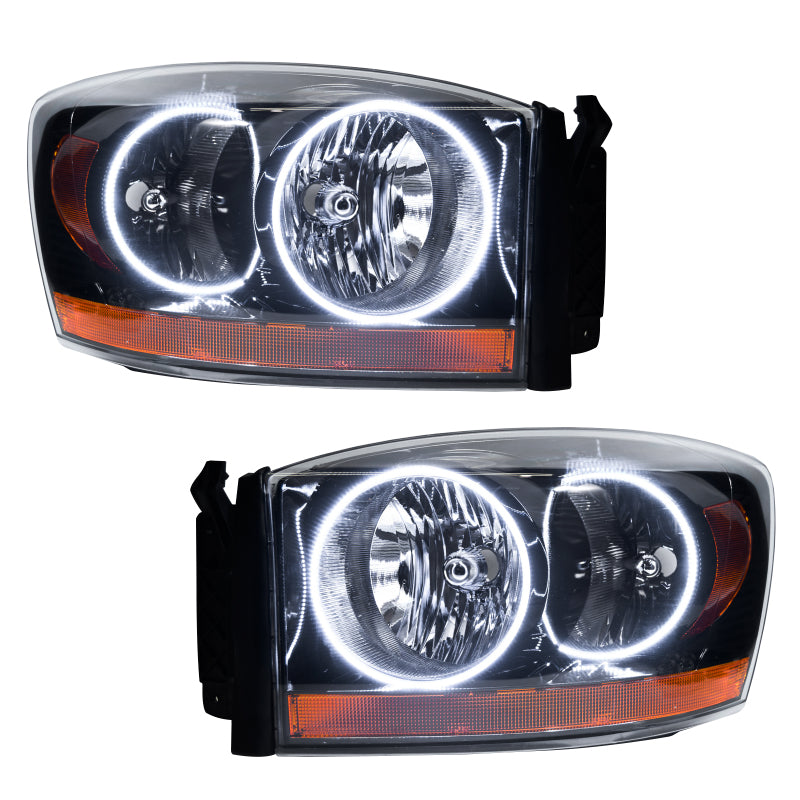 Oracle 06 Dodge Ram SMD headlights in black and white with halo rings, showcasing a modern design for enhanced visibility.