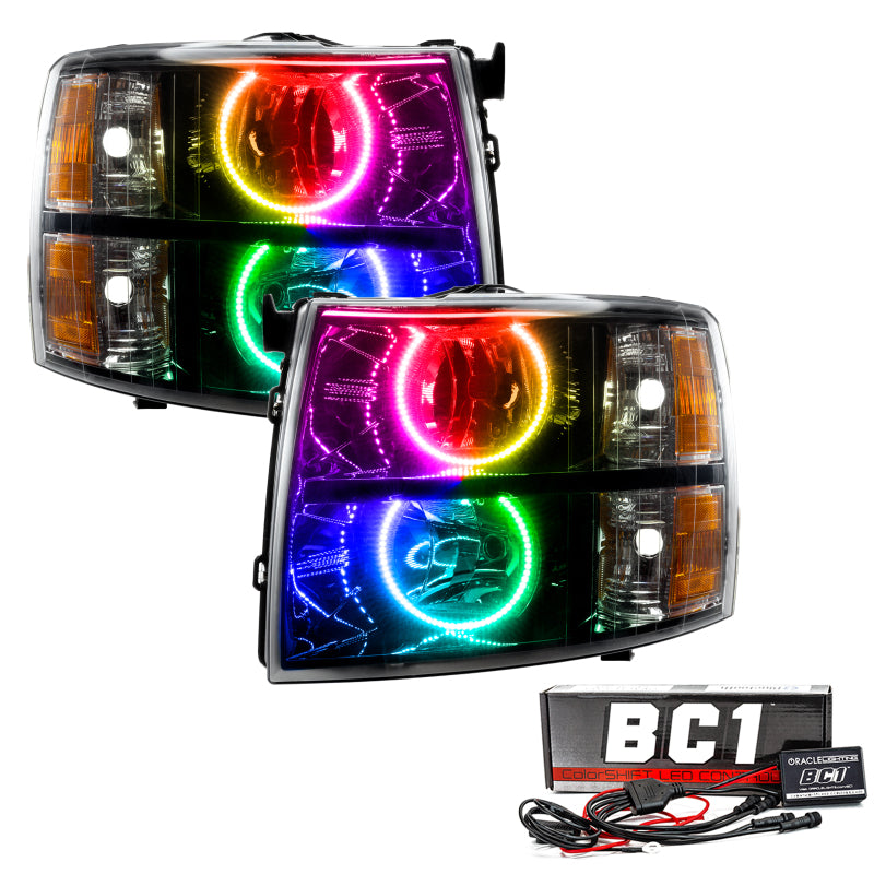 Oracle 07-13 Chevy Silverado SMD headlights in black round style with ColorSHIFT technology, showcasing vibrant LED lights.