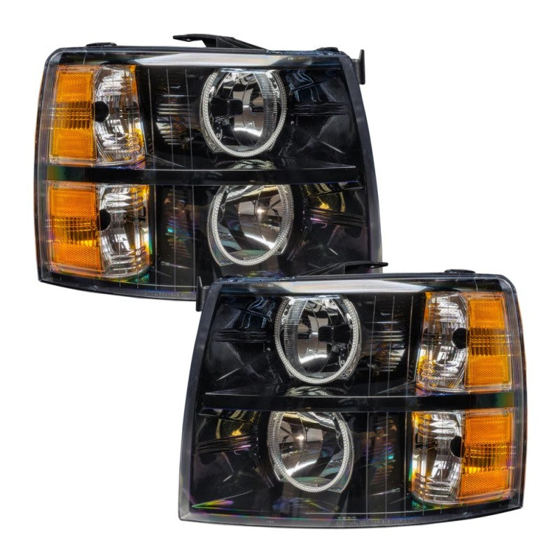 Oracle 07-13 Chevy Silverado SMD headlights in black round style with ColorSHIFT technology, showcasing vibrant LED lights.