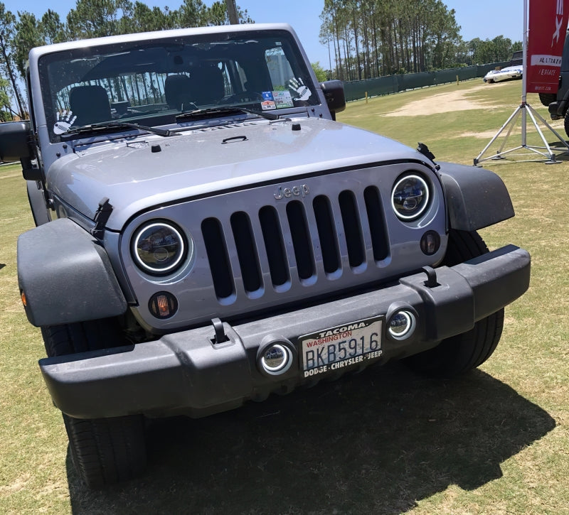 Oracle 07-18 Jeep Wrangler JK Switchback LED Halo Headlights with integrated amber turn signal, showcasing advanced LED technology and sleek design.