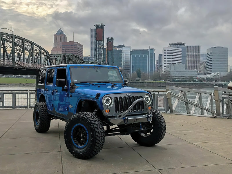 Oracle 07-18 Jeep Wrangler JK Switchback LED Halo Headlights with integrated amber turn signal, showcasing advanced LED technology and sleek design.