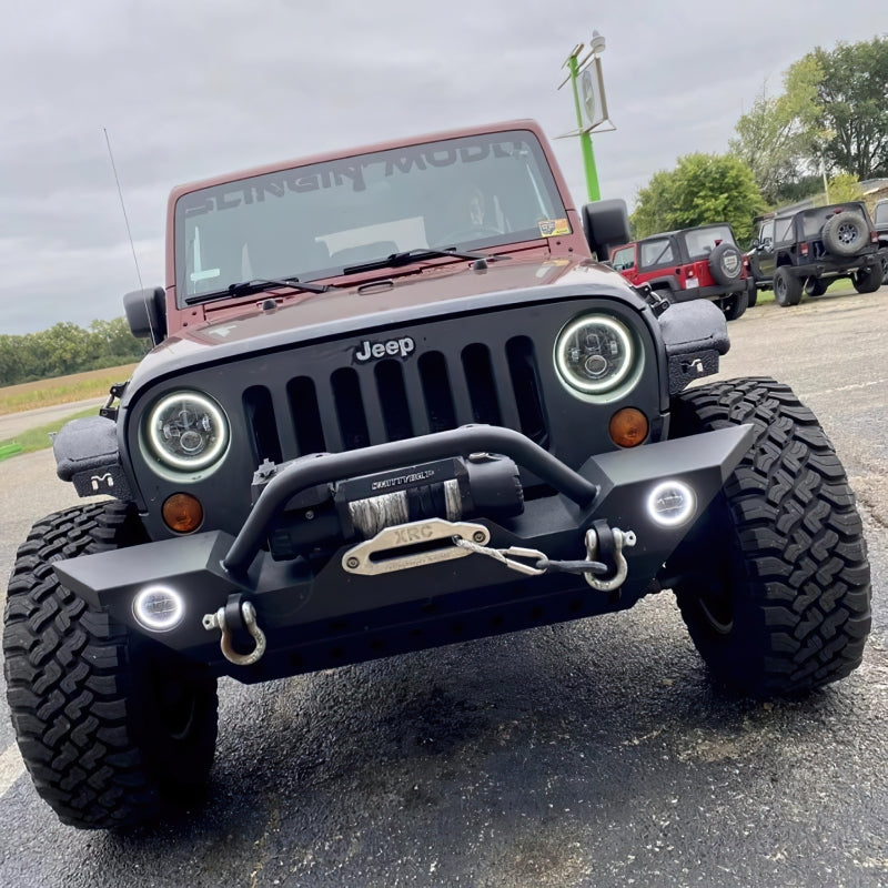 Oracle 07-18 Jeep Wrangler JK Switchback LED Halo Headlights with integrated amber turn signal, showcasing advanced LED technology and sleek design.