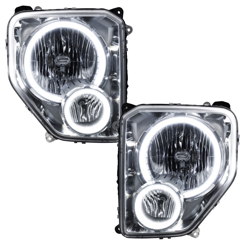 Oracle 08-12 Jeep Liberty SMD Headlights with white halo rings installed in black housing, showcasing enhanced visibility and modern design.