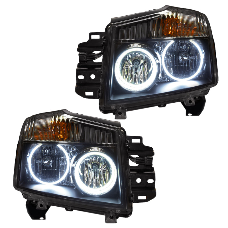 Oracle 08-15 Nissan Titan SMD headlights with white halo rings installed, showcasing chrome and black housing options.