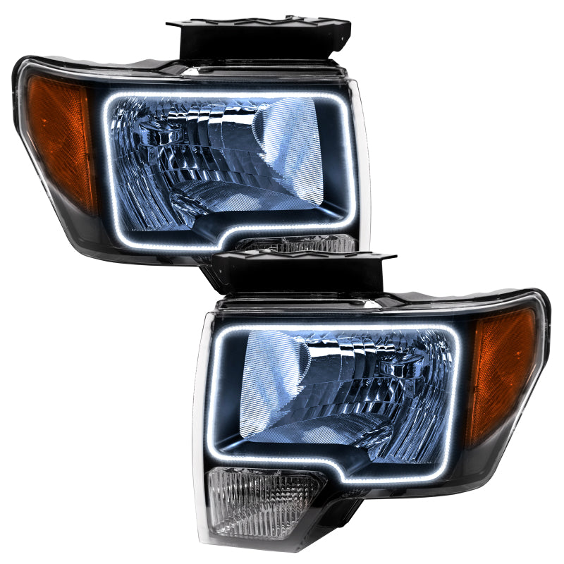 Oracle 09-14 Ford F-150 LED headlights in black housing with white halo rings, showcasing a modern and stylish design.