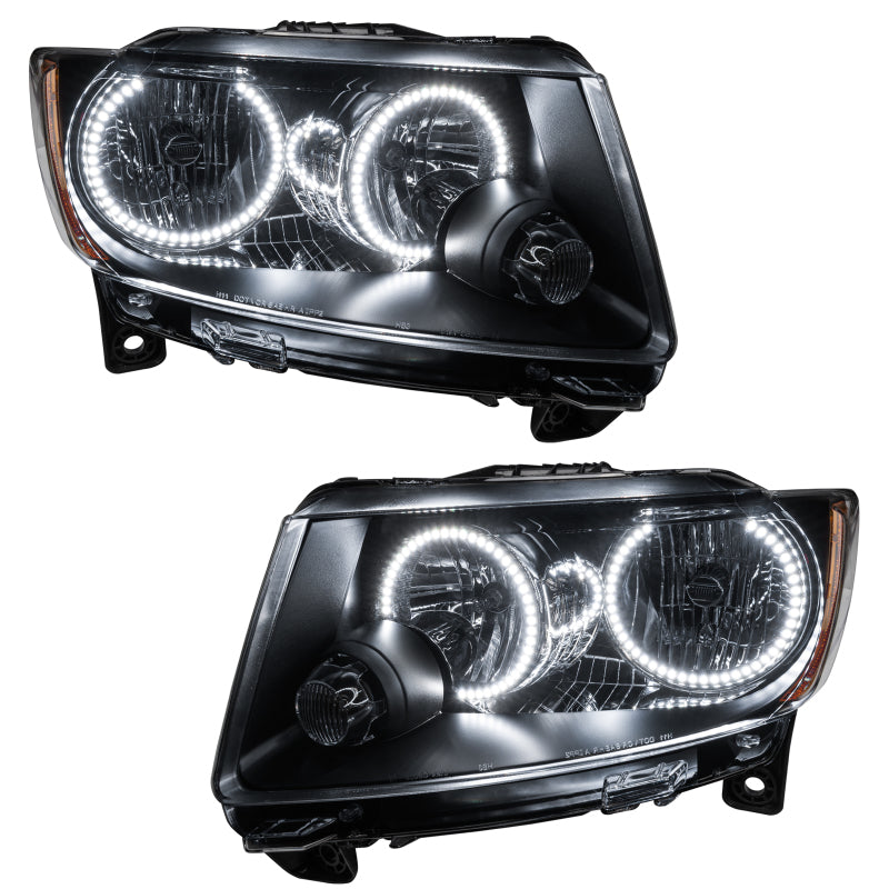 Oracle 11-13 Jeep Grand Cherokee SMD headlights with chrome housing and white halo rings, showcasing a modern design for enhanced visibility.