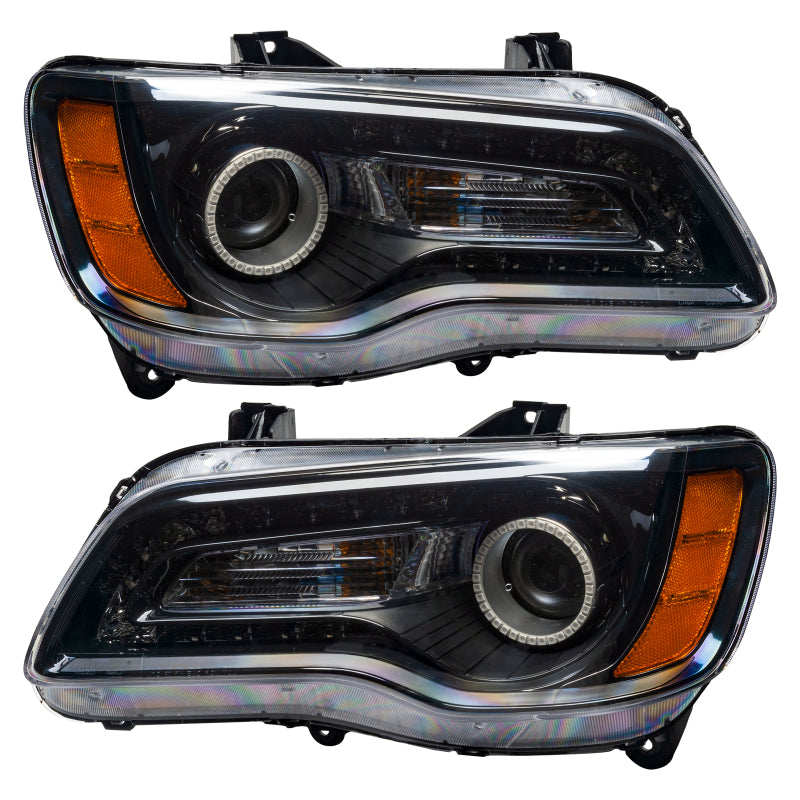 Oracle 11-14 Chrysler 300C SMD headlights in black housing with blue halo rings, showcasing a modern and stylish design.