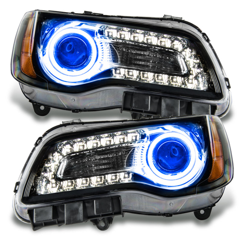 Oracle 11-14 Chrysler 300C SMD headlights in black housing with blue halo rings, showcasing a modern and stylish design.