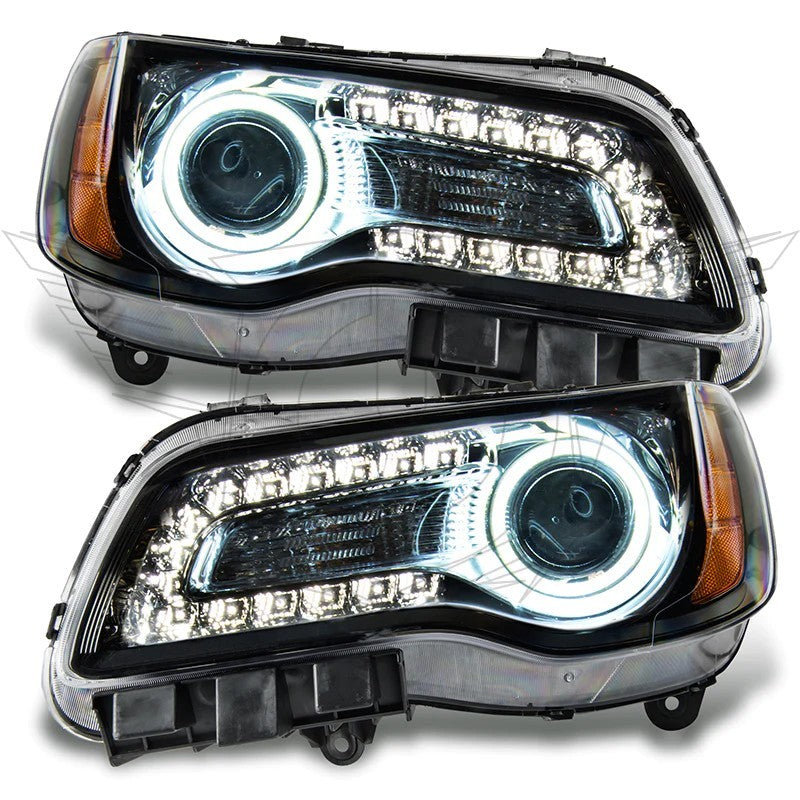 Oracle 11-14 Chrysler 300C SMD headlights in black housing with blue halo rings, showcasing a modern and stylish design.