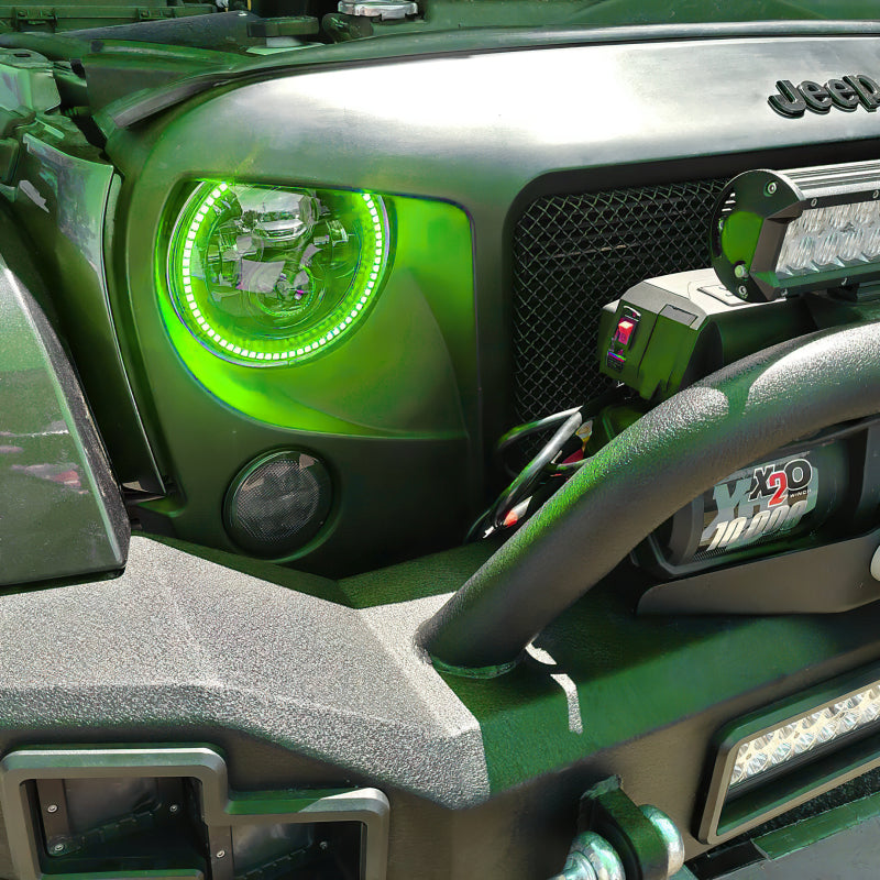 Oracle 7in High Powered LED Headlights with black bezel, showcasing rugged design and bright illumination.