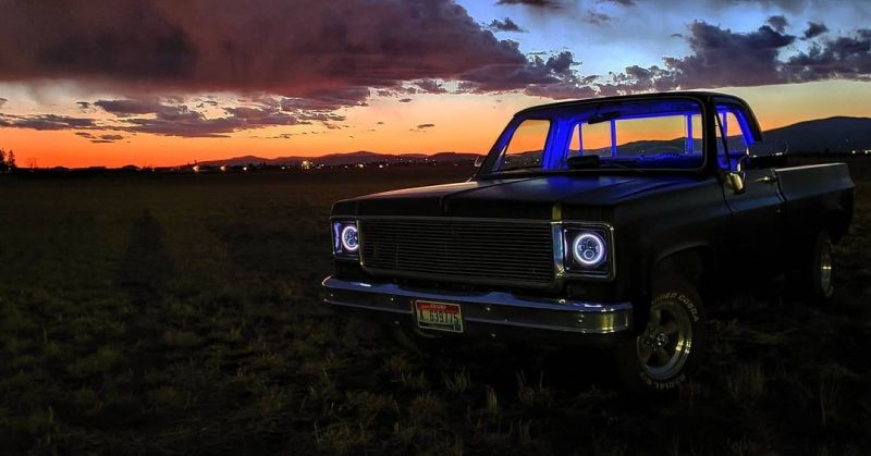 Oracle 7in High Powered LED Headlights with black bezel and white light, showcasing rugged design for Jeep and off-road vehicles.