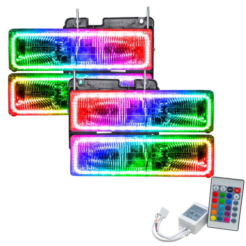 Oracle 92-99 GMC Yukon pre-assembled headlights with ColorSHIFT halo rings in Chrome and Black housing.