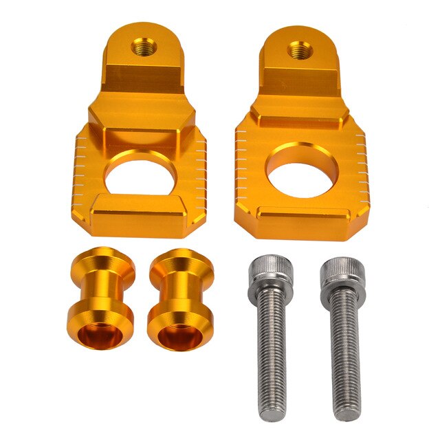 Gold and silver motorcycle chain tensioners.