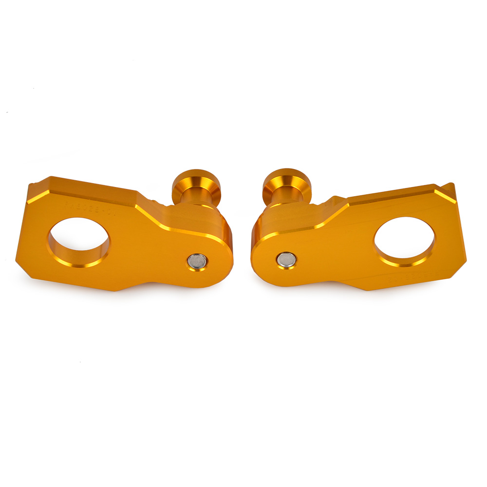 Golden motorcycle chain adjusters.