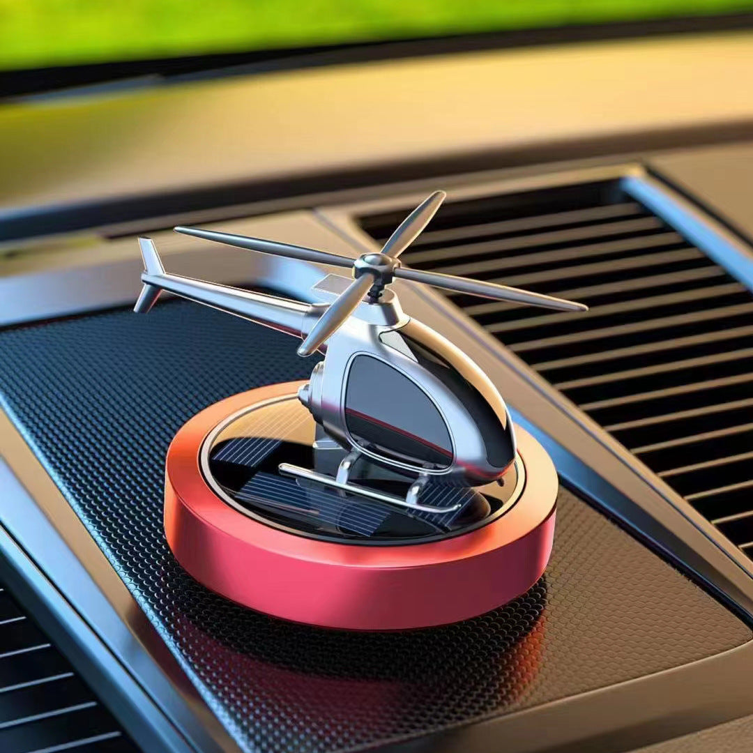 Solar Powered Car Perfume Ornament made of aluminum alloy, featuring a sleek design with an aircraft motif, perfect for enhancing car interiors.