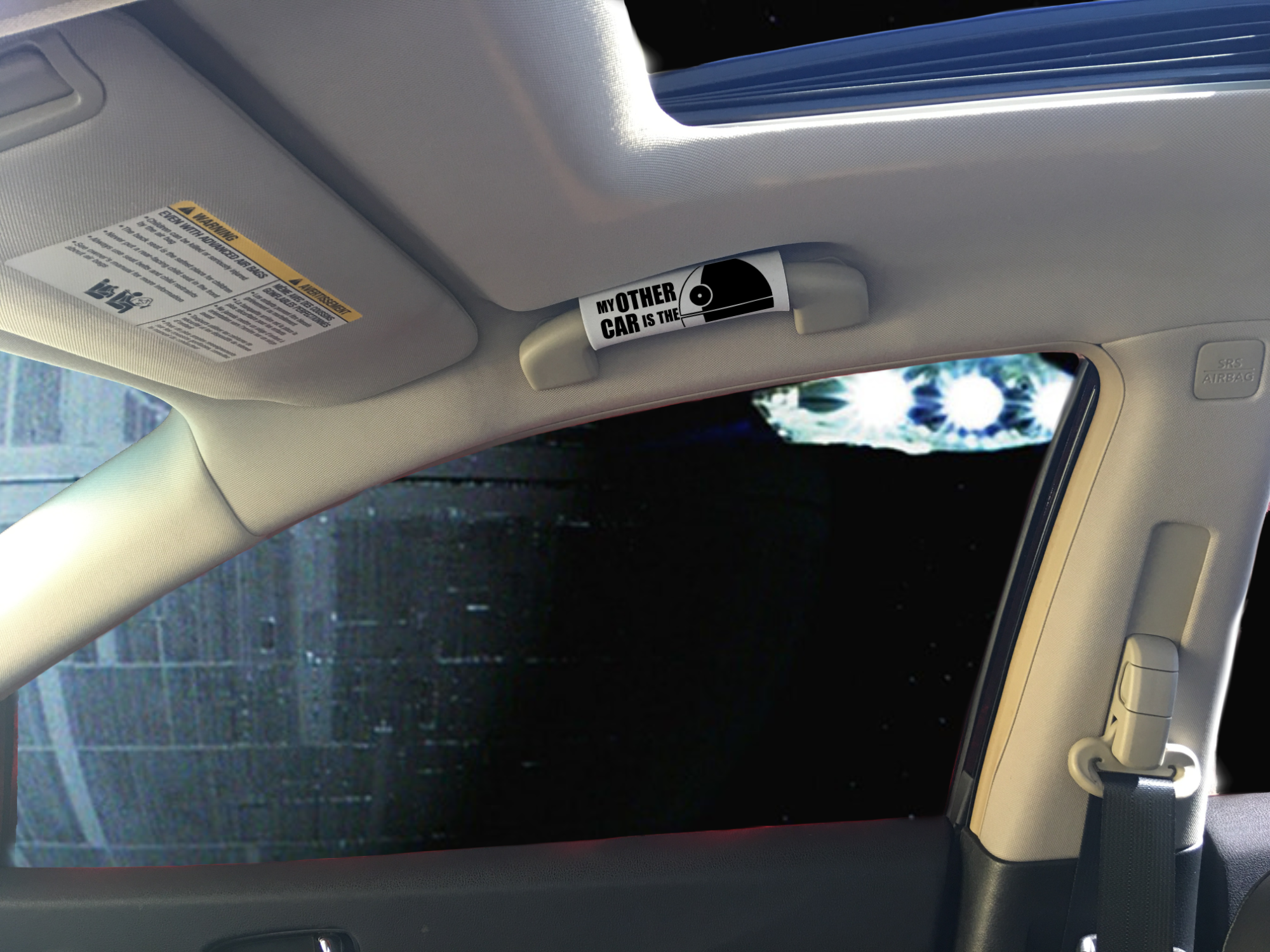 The DeathStar Grip featuring smooth artwork and a soft base, designed for vehicle interiors.