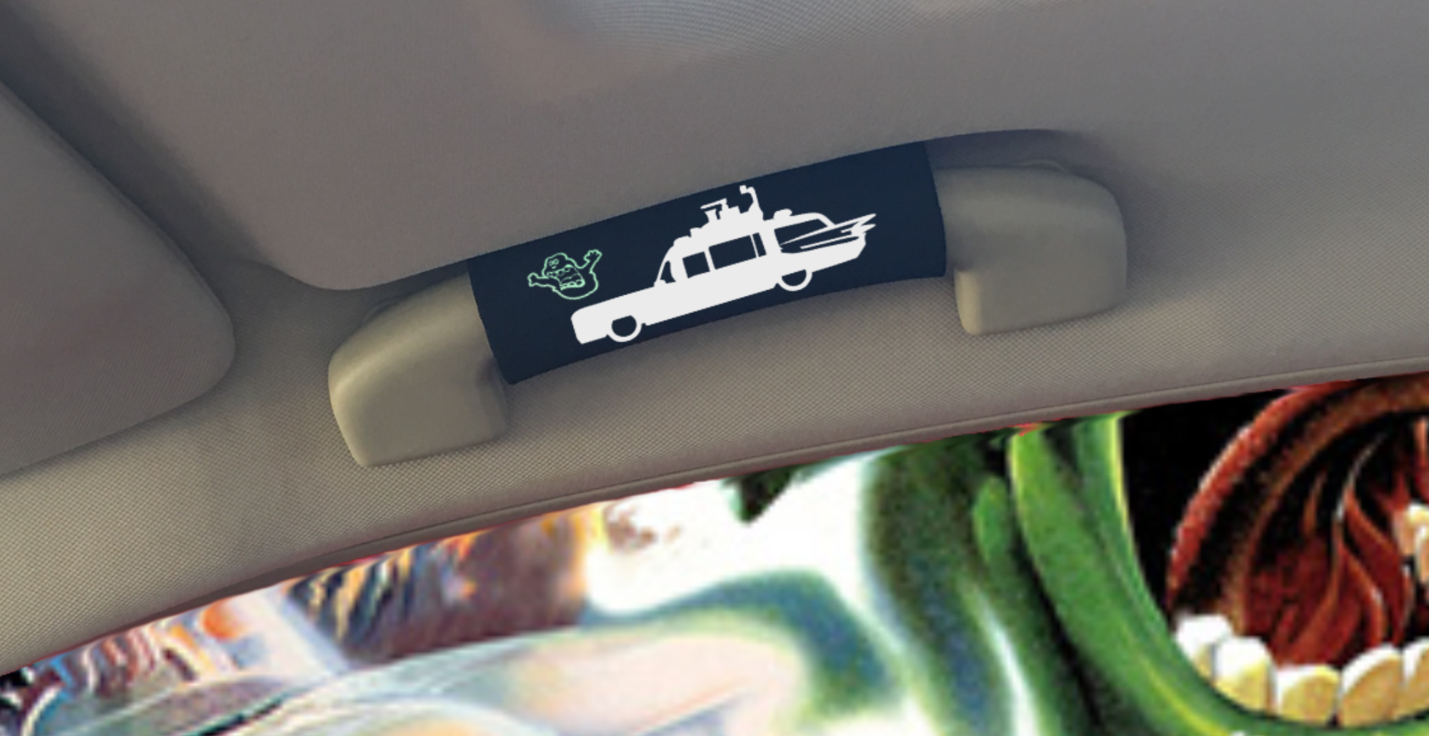 The Ghostbuster Grip featuring Slimer artwork that glows in the dark, designed for vehicle comfort and style.