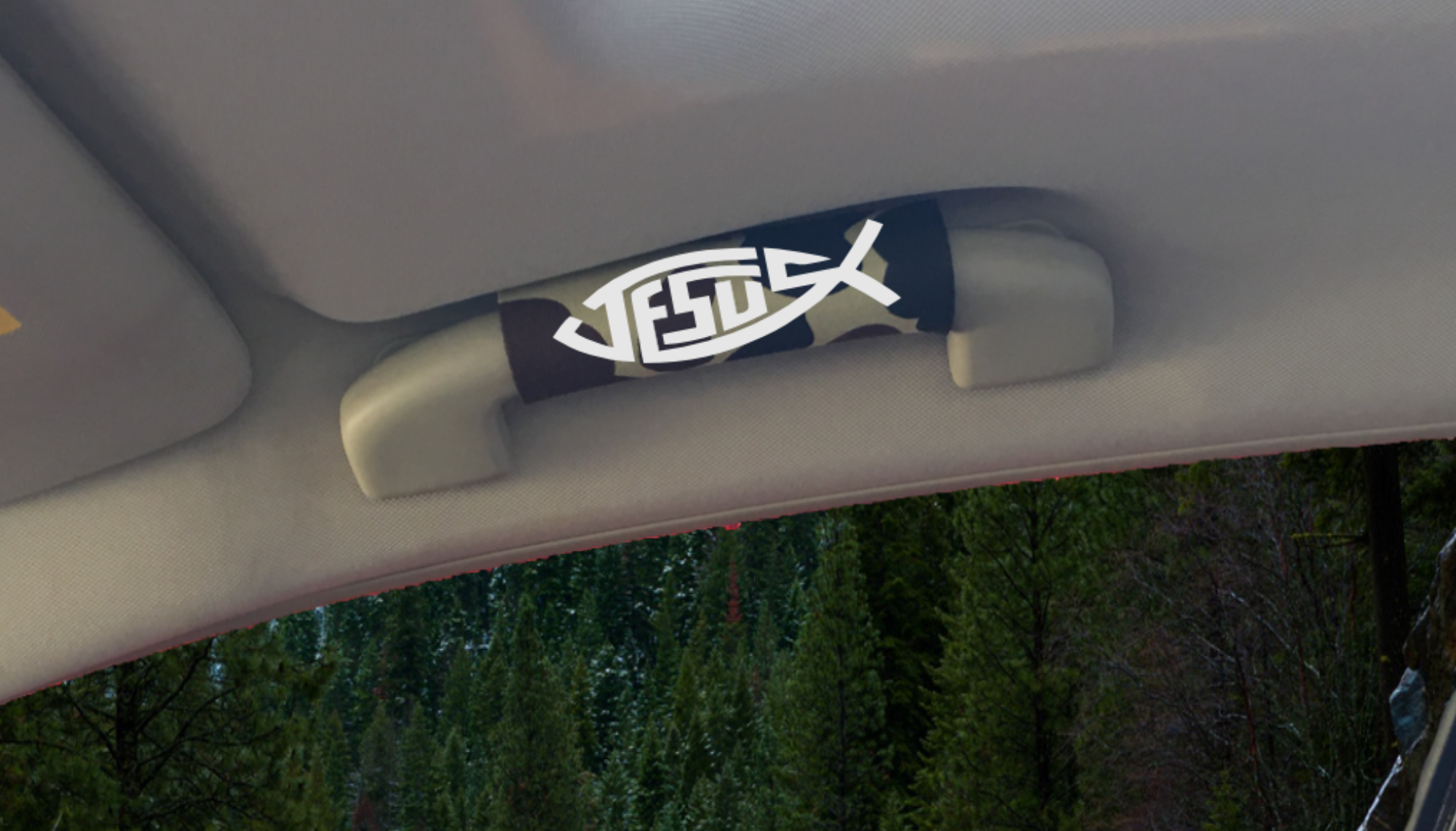 The Jesus Fish Grip featuring smooth artwork and a soft base, available in various colors for vehicle interiors.