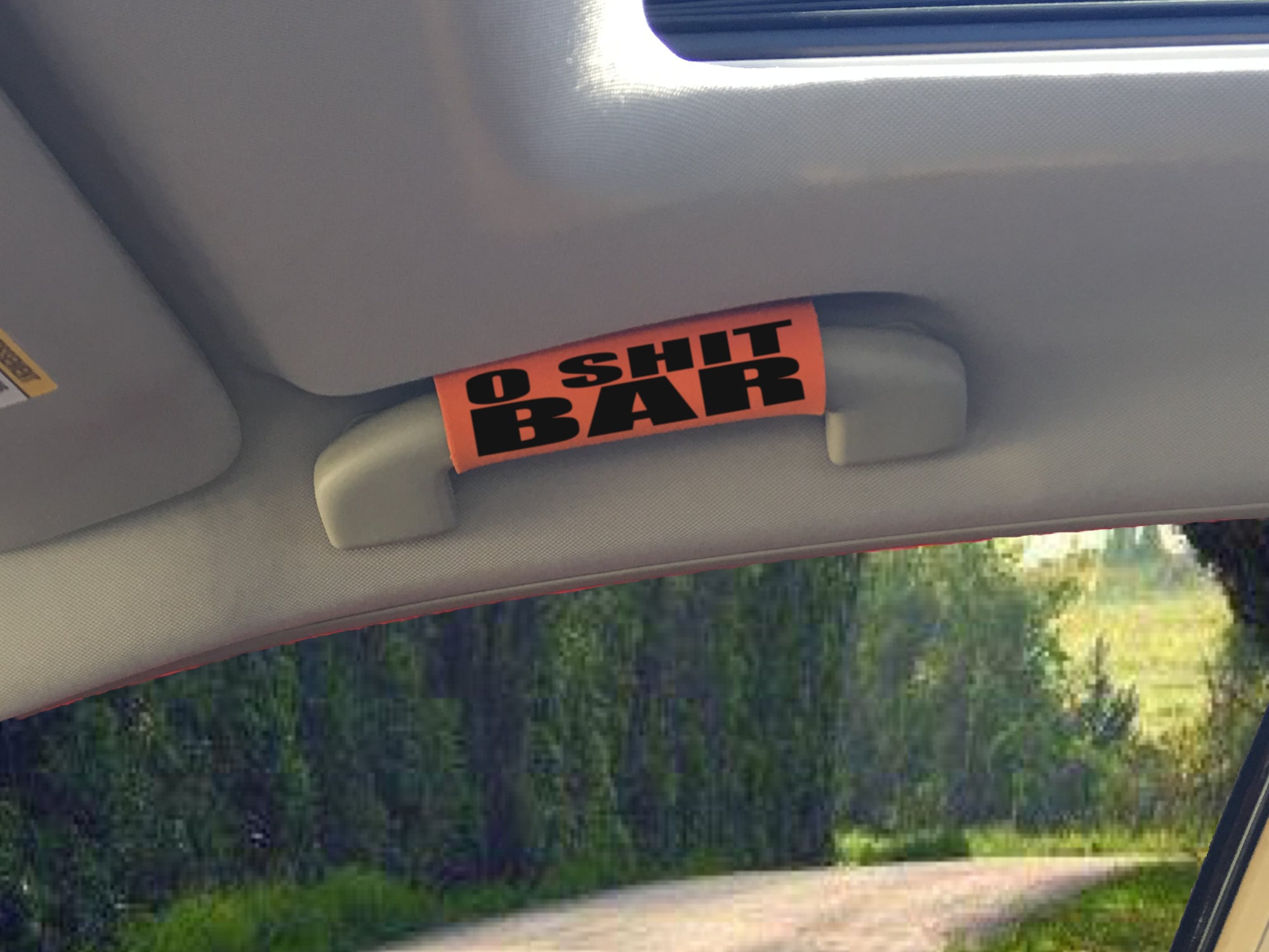 The O Shit Bar® featuring smooth artwork and a soft base, designed for comfort and style in vehicles.