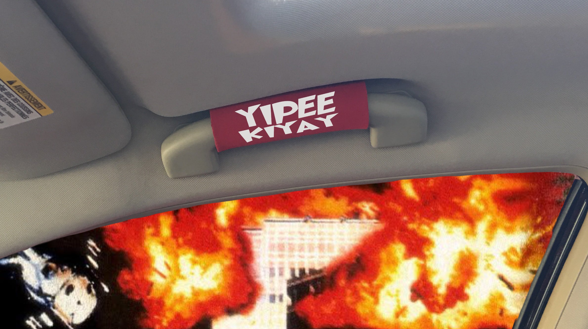 The YIPPIEKIYAY Grip featuring smooth artwork and a soft base, designed for comfort and style in any vehicle.