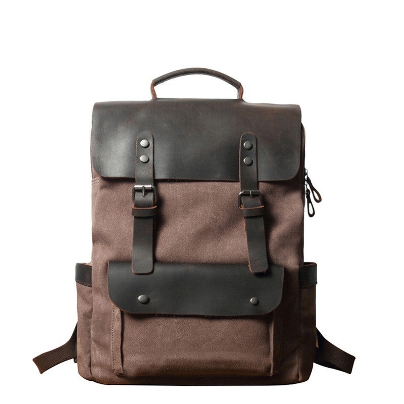 Breathable Leather Outdoor Canvas Backpack in a stylish design, featuring multiple pockets and a curved shoulder strap for comfort.