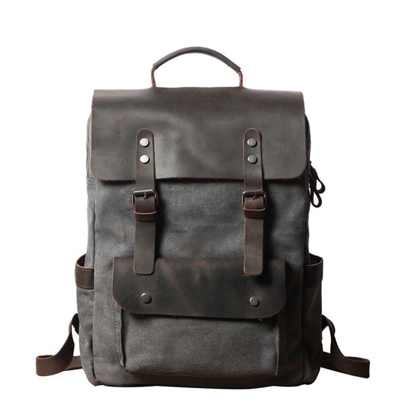 Breathable Leather Outdoor Canvas Backpack in a stylish design, featuring multiple pockets and a curved shoulder strap for comfort.