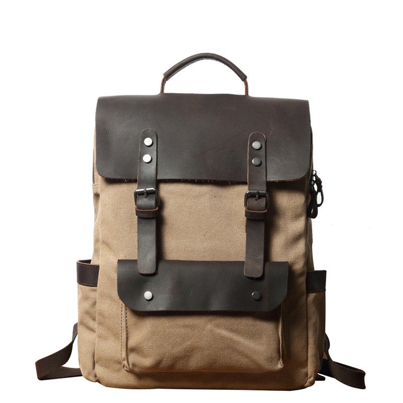 Breathable Leather Outdoor Canvas Backpack in a stylish design, featuring multiple pockets and a curved shoulder strap for comfort.