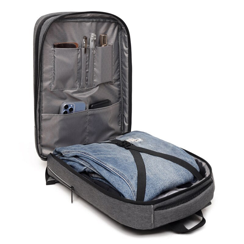 Large-capacity waterproof business backpack for men with USB charging port, featuring a stylish patchwork design and comfortable air cushion belt.