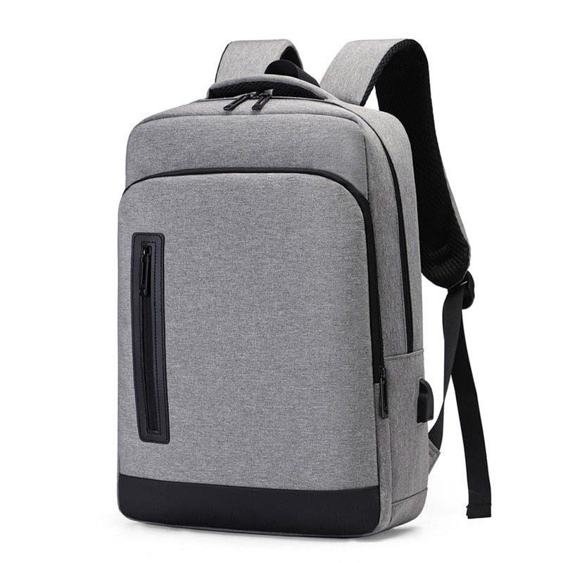 A multifunctional business backpack for men, featuring a USB charging port, waterproof Oxford material, and multiple interior pockets for organization.