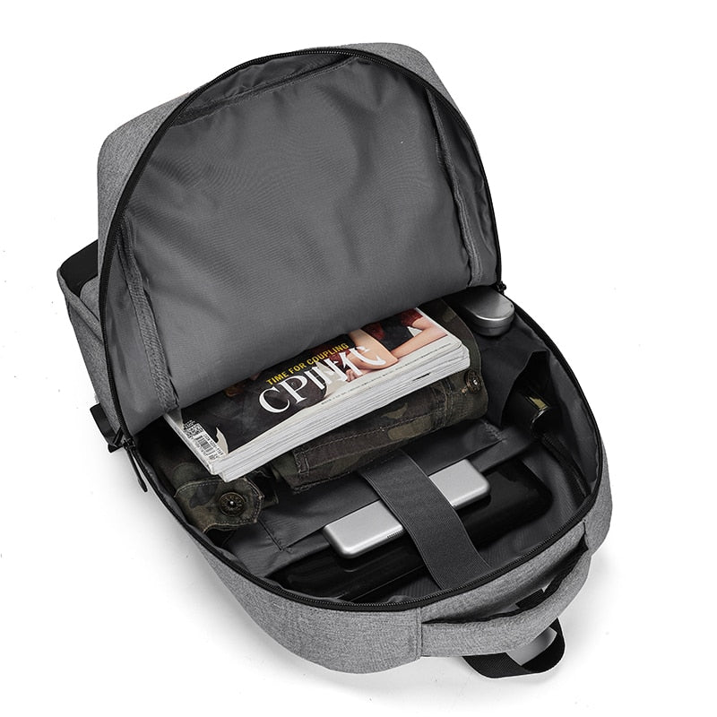 A multifunctional business backpack for men, featuring a USB charging port, waterproof Oxford material, and multiple interior pockets for organization.