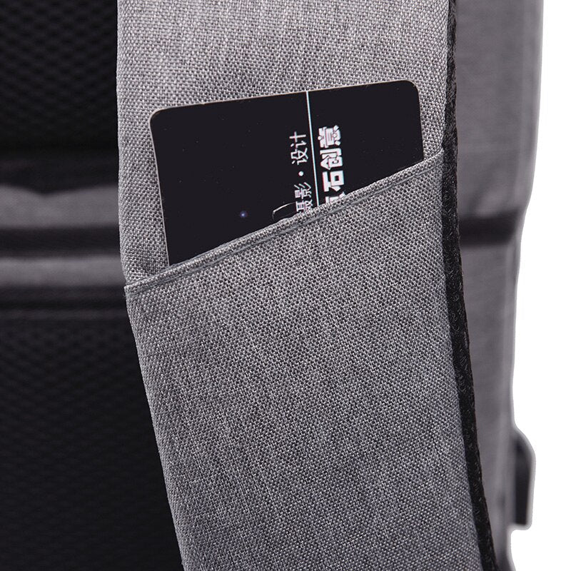 Business Man Backpack made of waterproof Oxford cloth, featuring USB charging port and multiple interior pockets for organization.