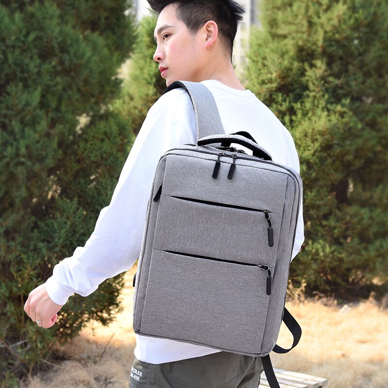 Business Man Backpack made of waterproof Oxford cloth, featuring USB charging port and multiple interior pockets for organization.