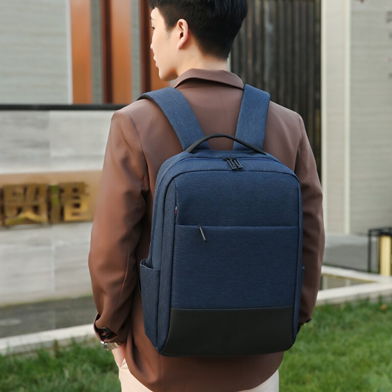 Business Men's Backpack made of waterproof nylon with multiple compartments and a stylish patchwork design, ideal for professionals.