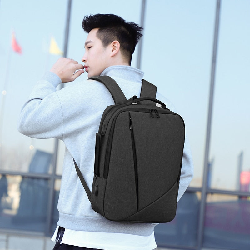 Business Men's Backpack featuring USB charging port, made of durable Oxford material, with multiple compartments and a stylish design.