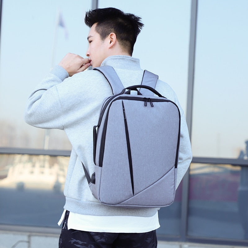 Business Men's Backpack featuring USB charging port, made of durable Oxford material, with multiple compartments and a stylish design.