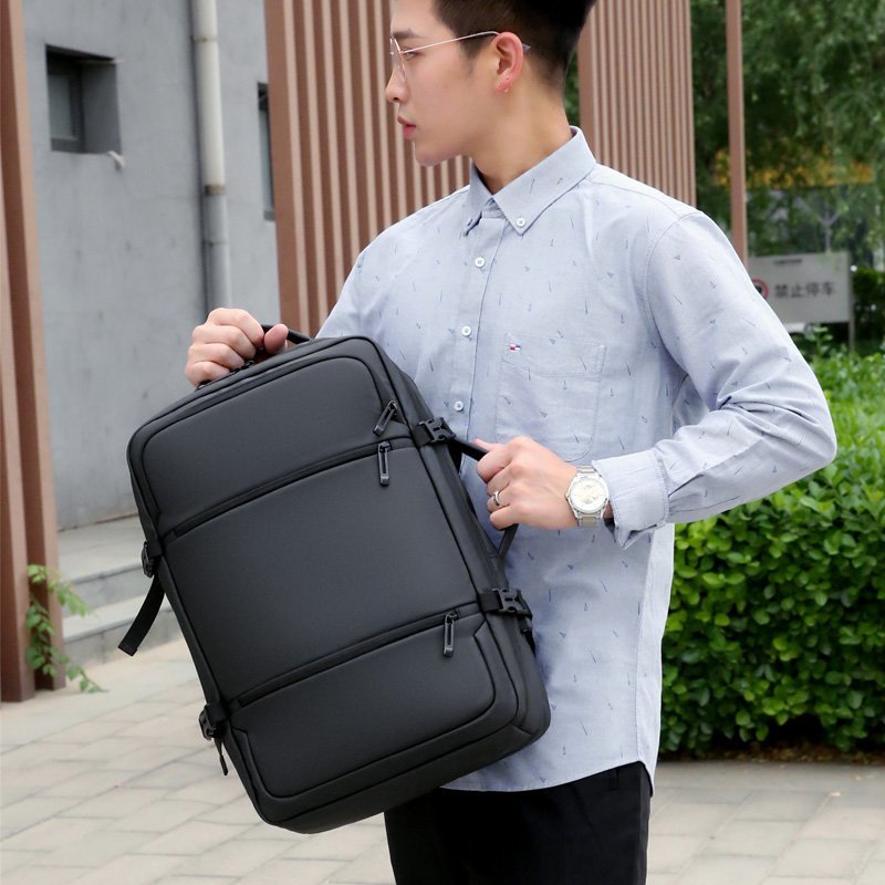 Multifunctional waterproof men's backpack with USB charging port, featuring a sleek design and spacious compartments.