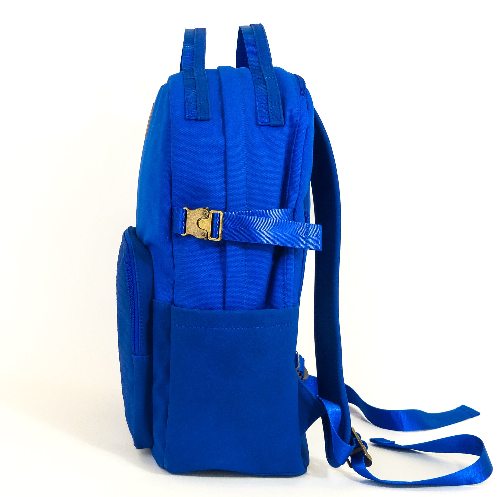 Eternal Optimist Cobalt Blue Backpack featuring a secret back pocket, padded laptop compartment, and eco-friendly materials.