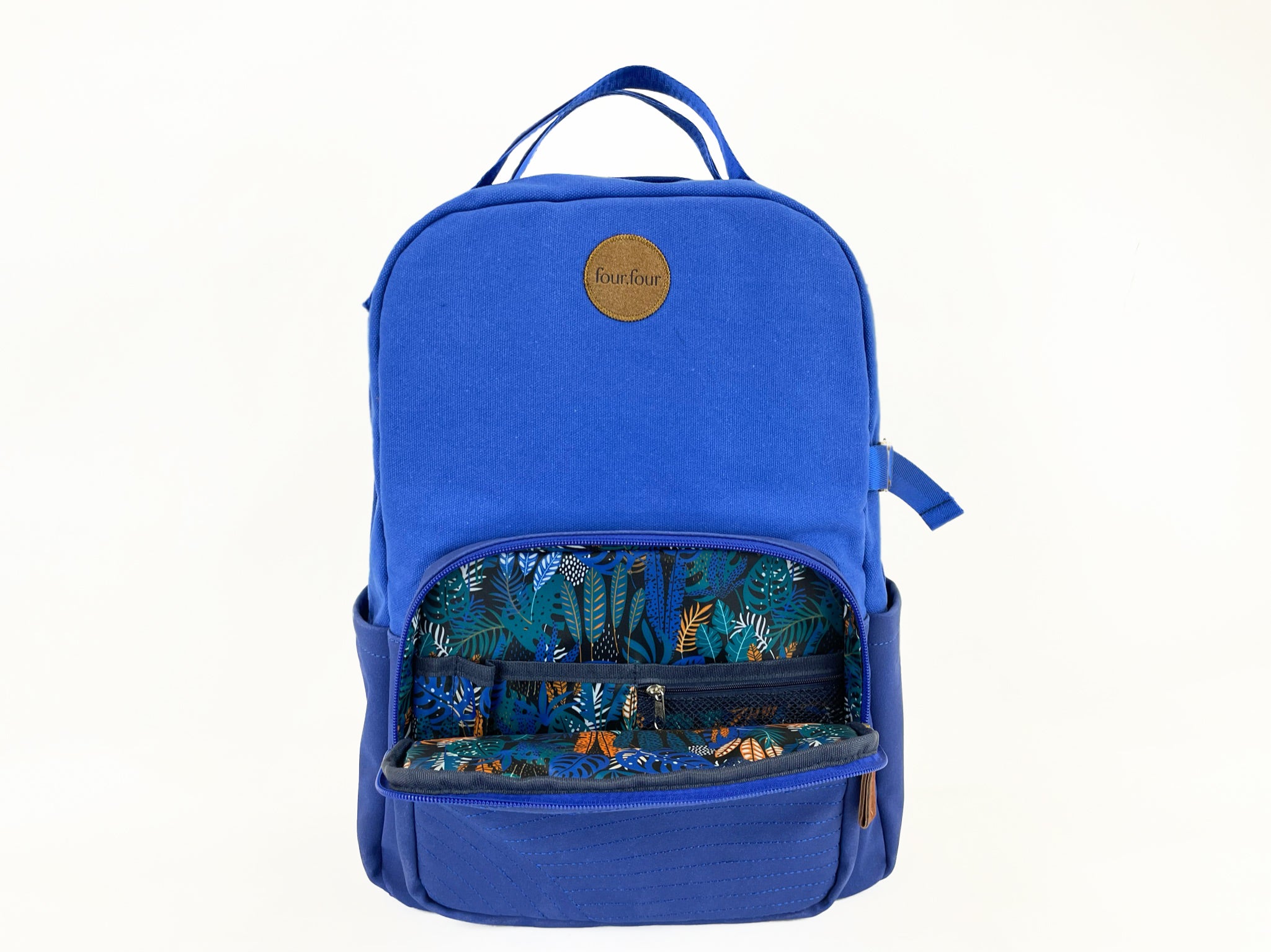 Eternal Optimist Cobalt Blue Backpack featuring a secret back pocket, padded laptop compartment, and eco-friendly materials.