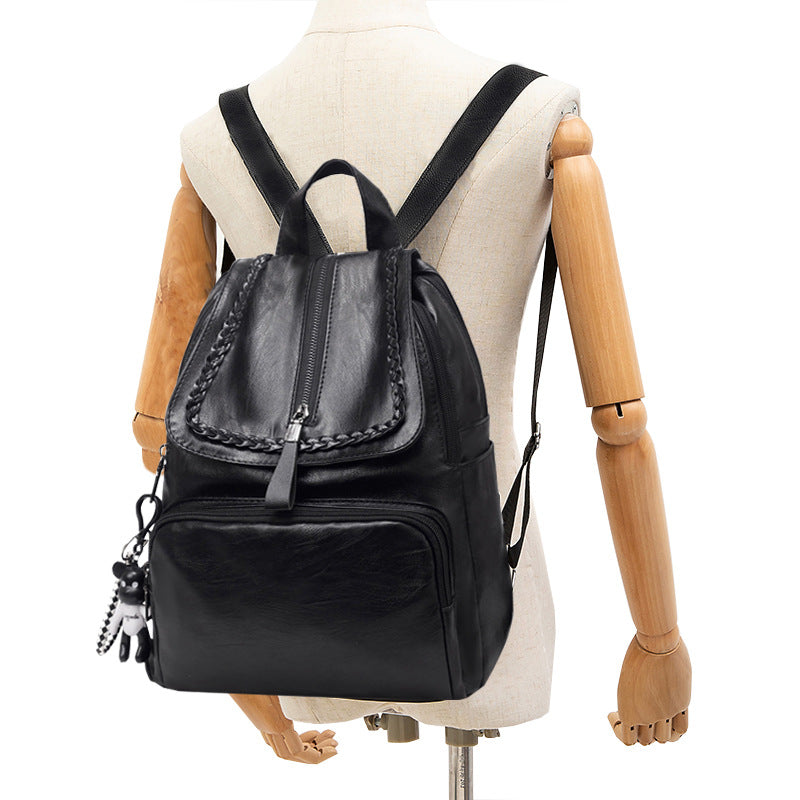 Fashionable large capacity travel backpack for ladies in stylish Korean design, made of durable PU fabric with double straps.