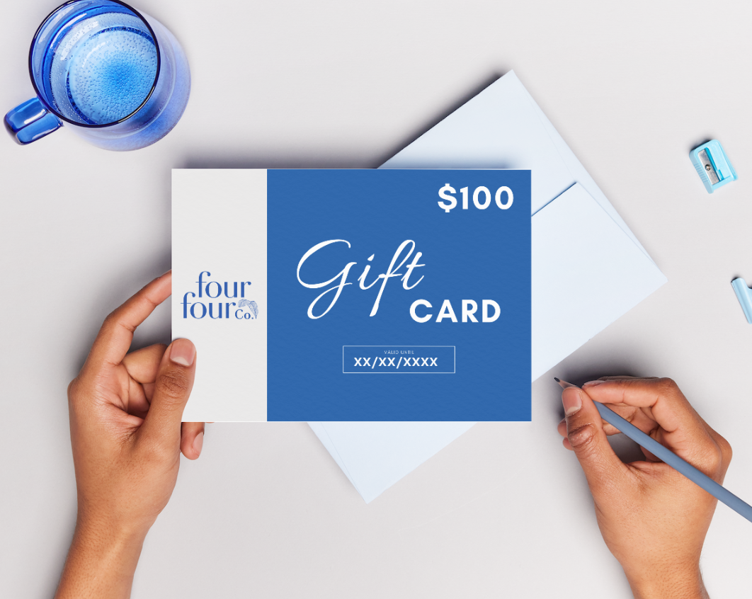 FourFour Co Gift Card displayed on a stylish background, showcasing its elegant design and branding.