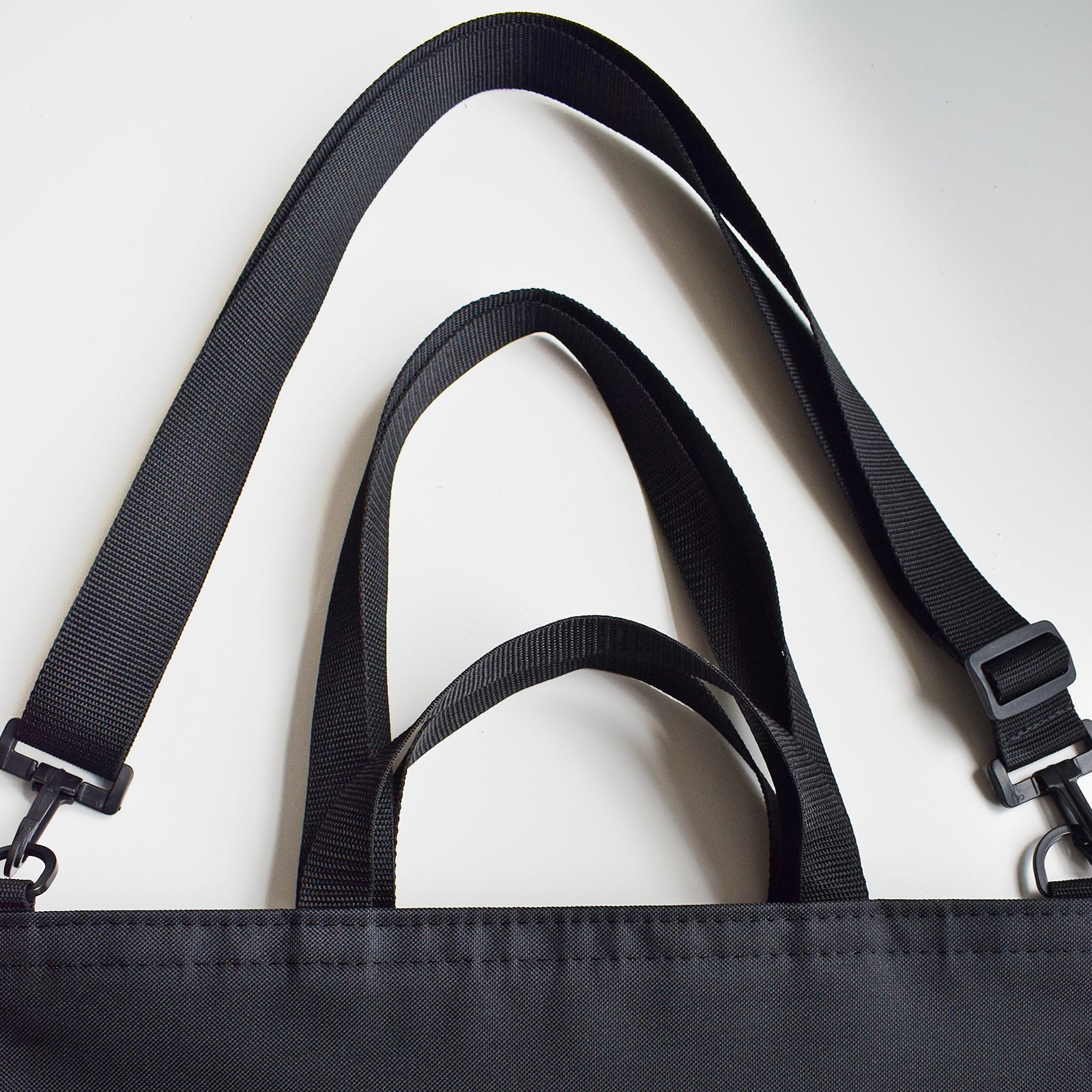 GoodDay Tote Bag in BLACK featuring two handles and an adjustable shoulder strap, designed for versatility and style.