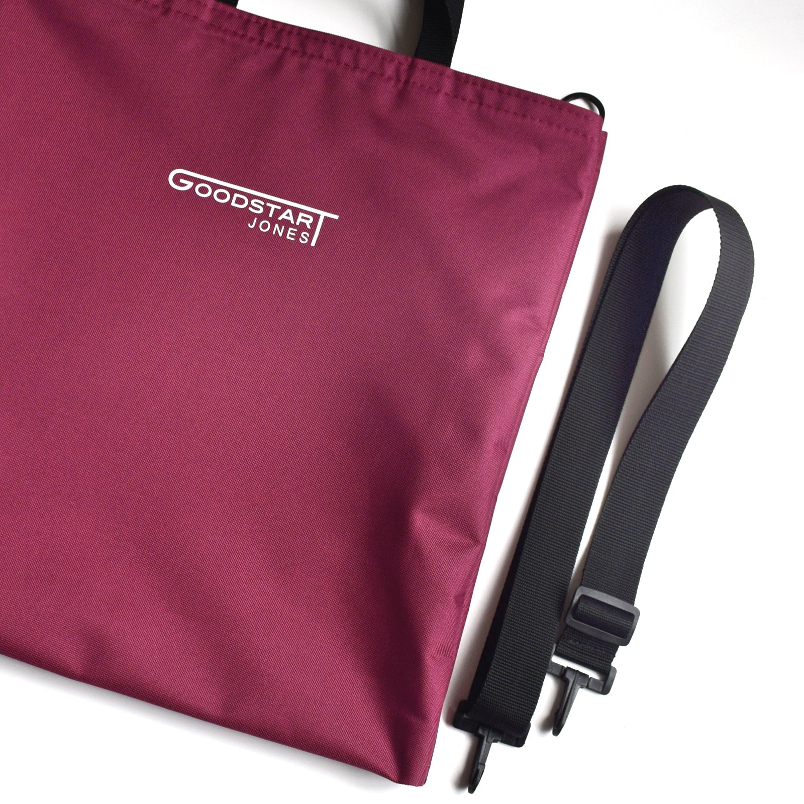 GoodDay Tote Bag in WINE color, featuring two handles and an adjustable shoulder strap, showcasing its spacious interior and water-resistant exterior.