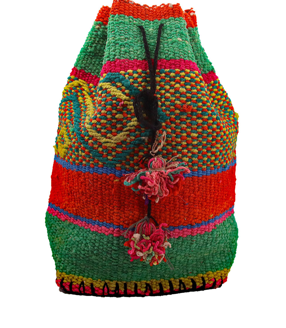 Lagó Spring Green Boho-Style Backpack featuring vibrant colors and geometric designs, handwoven by Quechua artisans.