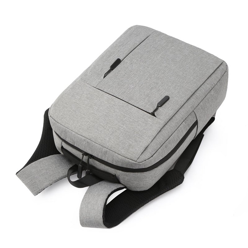 A stylish nylon laptop backpack designed for business and leisure, featuring adjustable shoulder straps and spacious compartments.