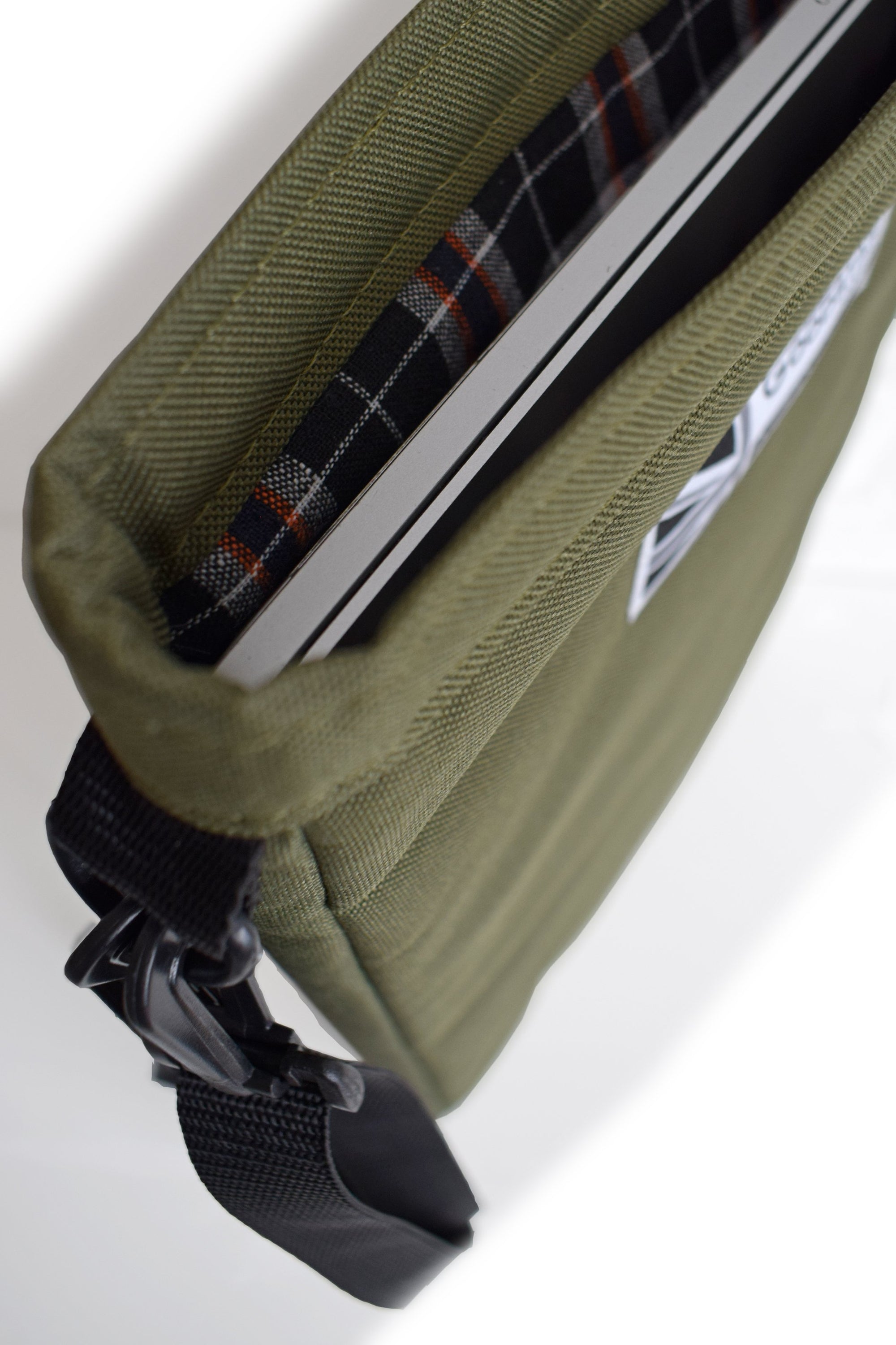 Olive Laptop Carry Case featuring a sleek design, padded interior, and multiple storage pockets for laptops and tablets.