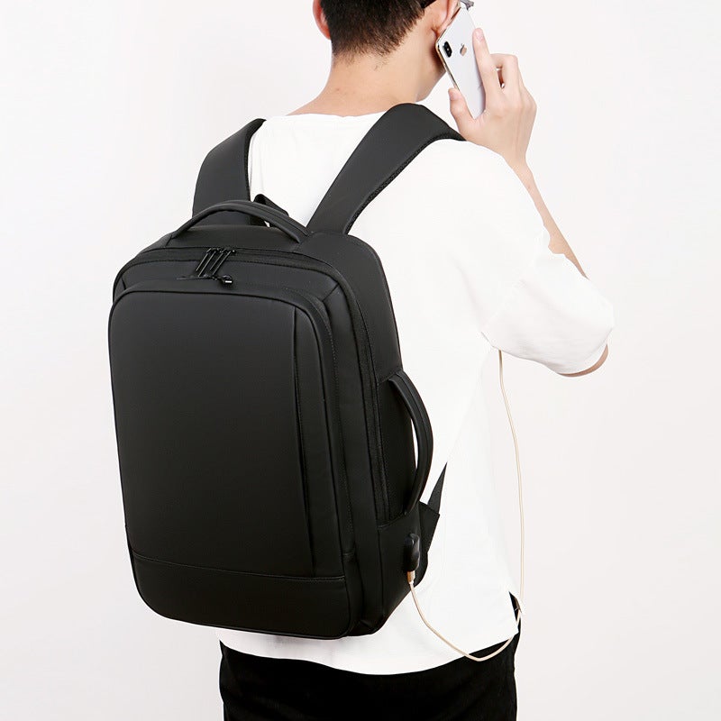 Large Capacity Multifunctional Waterproof Fashion Backpack in solid color, showcasing multiple pockets and USB charging feature.